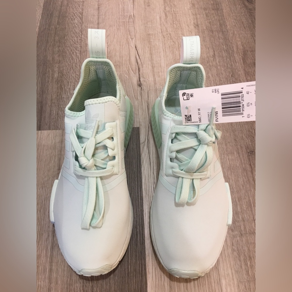 Mint green Adidas nmd_r1 sneakers.